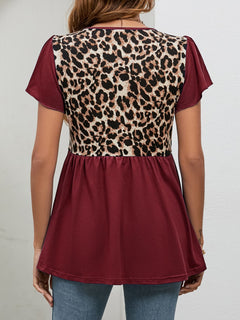 Back view of Leopard Round Neck Flutter Sleeve Babydoll Blouse showcasing chic leopard print and ruffle design.