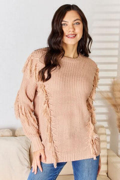 And The Why tassel detail long sleeve sweater in soft pink, featuring bohemian fringe accents and a cozy, relaxed fit.