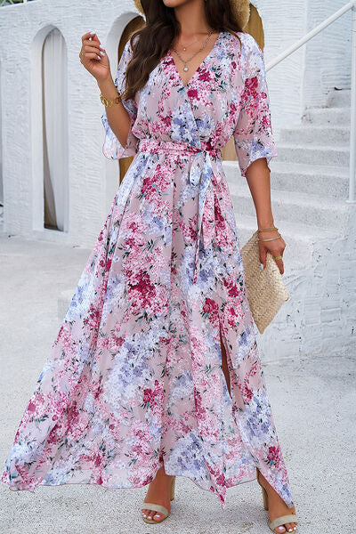 Beautiful model in a floral printed tied half sleeve slit dress, perfect for summer outings.
