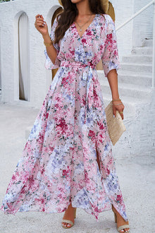 Beautiful model in a floral printed tied half sleeve slit dress, perfect for summer outings.