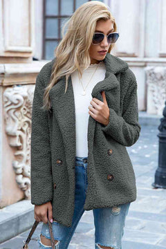 Stylish woman in an olive green lapel collar sherpa coat with double-breasted buttons and sunglasses.