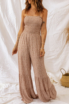 Floral Spaghetti Strap Smocked Wide Leg Jumpsuit showcased on a model, featuring a smocked neckline and floral pattern.