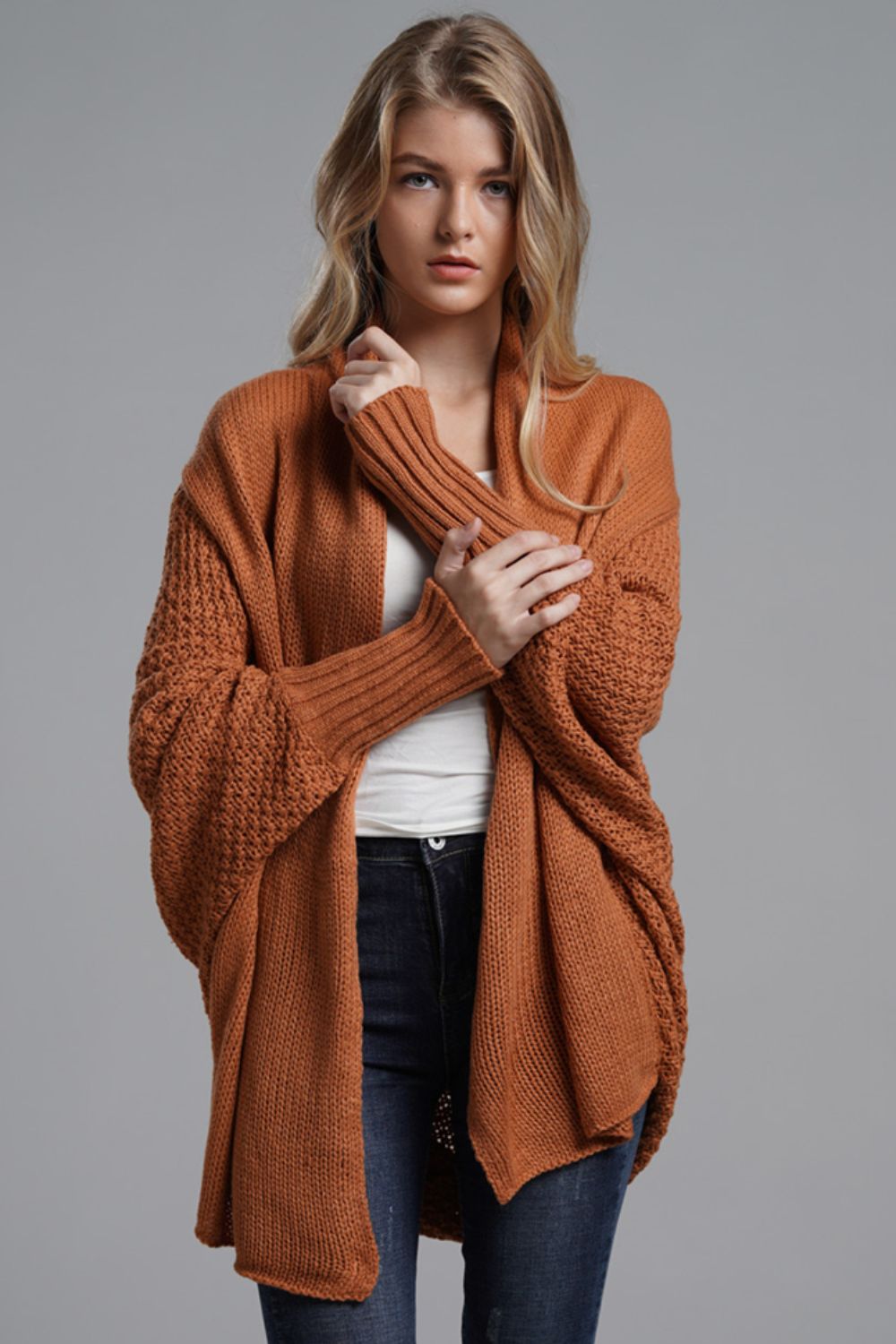 Model wearing Double Take Dolman Sleeve Open Front Ribbed Trim Longline Cardigan in rust, showcasing casual and chic style.