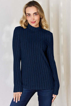 Model wearing Basic Bae ribbed mock neck long sleeve t-shirt in navy blue, showcasing its stylish design and fit.