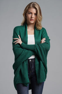Model wearing a green dolman sleeve longline cardigan with ribbed trim, showcasing a casual and chic style.