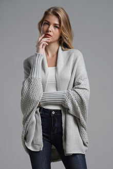 Model wearing a Double Take Dolman Sleeve Open Front Longline Cardigan in light gray with ribbed trim.