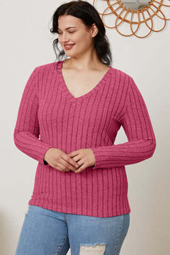 Plus size ribbed V-neck long sleeve t-shirt in pink, perfect for casual wear and versatile styling.